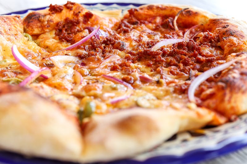 BBQ chicken pizza with red onions and cilantro