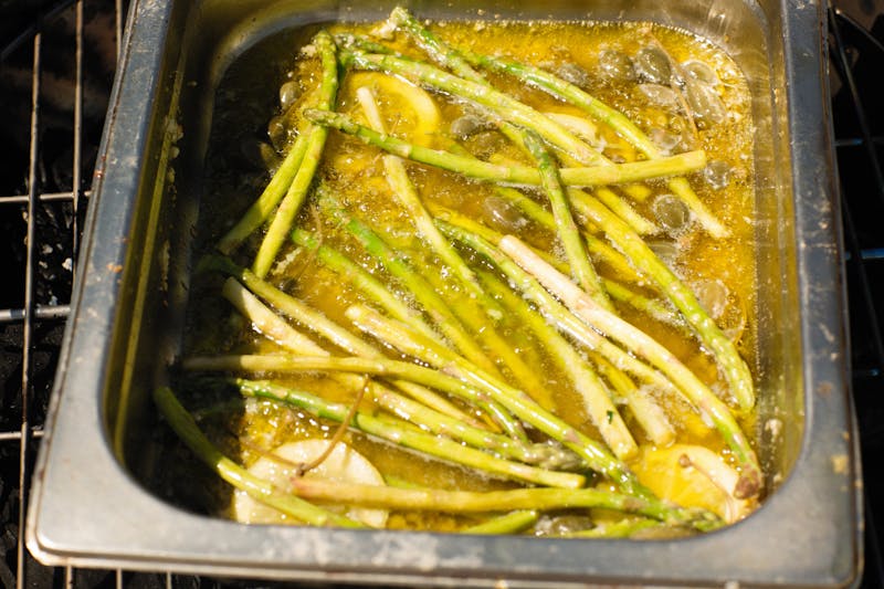 Grilled salmon with lemon butter and asparagus